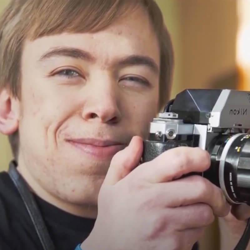 Image: Kevin holding a camera